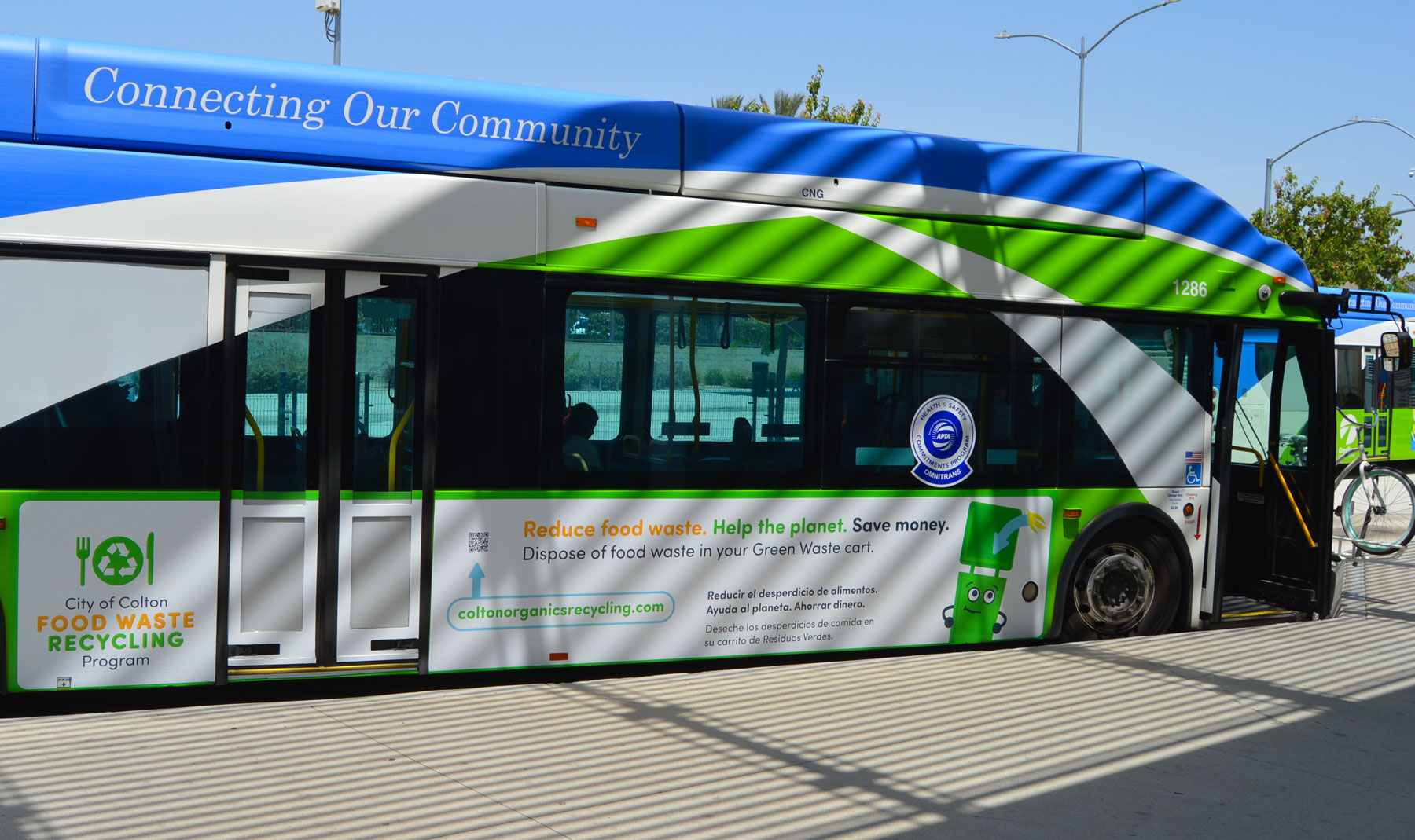 Food Waste Recycling Program bilingual bus wrap installed on an Omnitrans bus in Colton, California